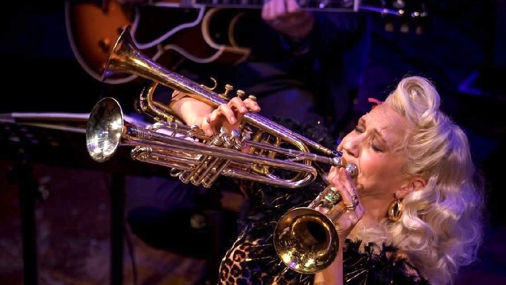 Gunhild Carling playing trumpet on stage
